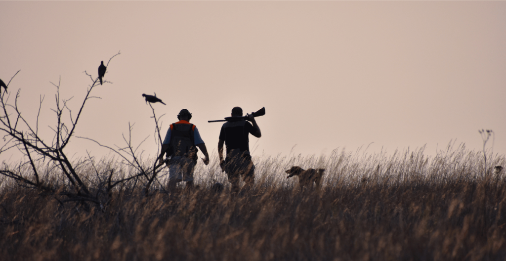 2 hunters and a hunting dog