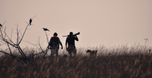 2 hunters and a hunting dog